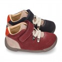 Suede leather Kids SPORT ankle boots with elastic laces and hook and loop strap closure.