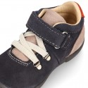 Suede leather Kids SPORT ankle boots with elastic laces and hook and loop strap closure.