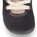 Suede leather Kids SPORT ankle boots with elastic laces and hook and loop strap closure.