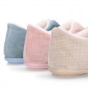 SQUARE design wool knit kids home shoes with central opening.