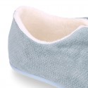 SQUARE design wool knit kids home shoes with central opening.