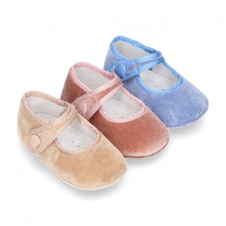 Velvet little Mary Janes for babies with hook and loop strap closure and button.