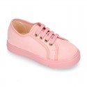 Autumn winter canvas OKAA kids tennis shoes to dress with shoelaces closure in pastel colors.