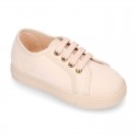 Autumn winter canvas OKAA kids tennis shoes to dress with shoelaces closure in pastel colors.