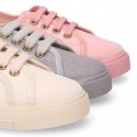 Autumn winter canvas OKAA kids tennis shoes to dress with shoelaces closure in pastel colors.