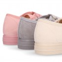 Autumn winter canvas OKAA kids tennis shoes to dress with shoelaces closure in pastel colors.