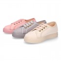 Autumn winter canvas OKAA kids tennis shoes to dress with shoelaces closure in pastel colors.