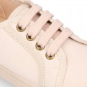 Autumn winter canvas OKAA kids tennis shoes to dress with shoelaces closure in pastel colors.