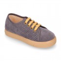 Corduroy canvas OKAA kids tennis shoes to dress with shoelaces closure.