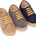 Corduroy canvas OKAA kids tennis shoes to dress with shoelaces closure.