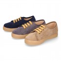 Corduroy canvas OKAA kids tennis shoes to dress with shoelaces closure.