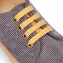 Corduroy canvas OKAA kids tennis shoes to dress with shoelaces closure.