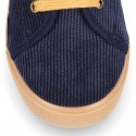 Corduroy canvas OKAA kids tennis shoes to dress with shoelaces closure.