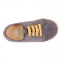 Corduroy canvas OKAA kids tennis shoes to dress with shoelaces closure.