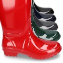 Knee high rain boots in plain colors with glossy finish, in large sizes.