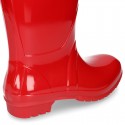 Knee high rain boots in plain colors with glossy finish, in large sizes.