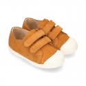 Kids suede leather Tennis type shoes with laceless and toe cap in TAN color.