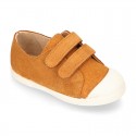 Kids suede leather Tennis type shoes with laceless and toe cap in TAN color.