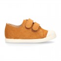 Kids suede leather Tennis type shoes with laceless and toe cap in TAN color.