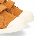 Kids suede leather Tennis type shoes with laceless and toe cap in TAN color.