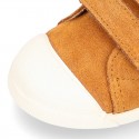 Kids suede leather Tennis type shoes with laceless and toe cap in TAN color.