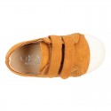 Kids suede leather Tennis type shoes with laceless and toe cap in TAN color.