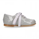 Classic Patent leather Laces up shoes in soft colors.