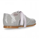 Classic Patent leather Laces up shoes in soft colors.