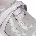 Classic Patent leather Laces up shoes in soft colors.
