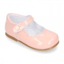 Patent leather little Mary Janes with button fastening.