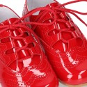 Classic English style shoes in RED patent leather.