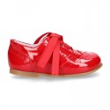 Classic Laces up shoes in red patent leather.