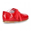 Classic Laces up shoes in red patent leather.