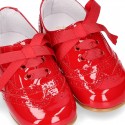 Classic Laces up shoes in red patent leather.