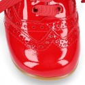 Classic Laces up shoes in red patent leather.