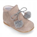 Classic suede leather ankle boots with POMPONS.