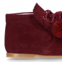 Classic suede leather ankle boots with POMPONS.