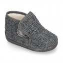 Structured wool knit bootie home shoes with hook and loop strap.