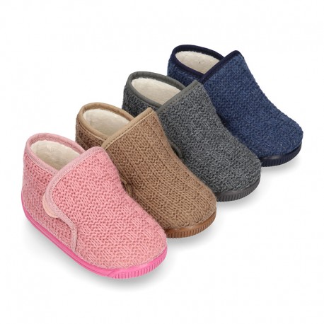 Structured wool knit bootie home shoes with hook and loop strap.