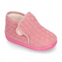 Structured wool knit bootie home shoes with hook and loop strap.