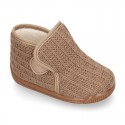 Structured wool knit bootie home shoes with hook and loop strap.