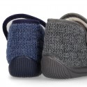 Structured wool knit bootie home shoes with hook and loop strap.