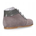 Classic patent leather ankle boots to dress combined with soft suede leather for first steps.