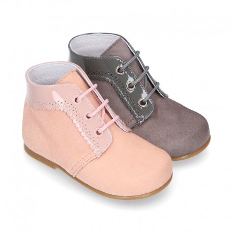 Classic patent leather ankle boots to dress combined with soft suede leather for first steps.