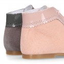 Classic patent leather ankle boots to dress combined with soft suede leather for first steps.