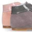 Classic patent leather ankle boots to dress combined with soft suede leather for first steps.