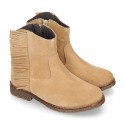 Ankle boot shoes in suede leather with fringed detail.