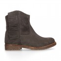 Ankle boot shoes in suede leather with fringed detail.