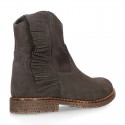 Ankle boot shoes in suede leather with fringed detail.