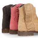 Ankle boot shoes in suede leather with fringed detail.